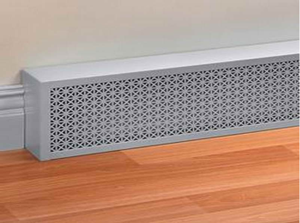 White electric baseboard heating system attached to the baseboard wall.