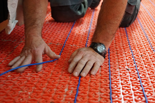 Warmup's Radiant Floor Heating DCM-PRO Cable being installed in membrane.