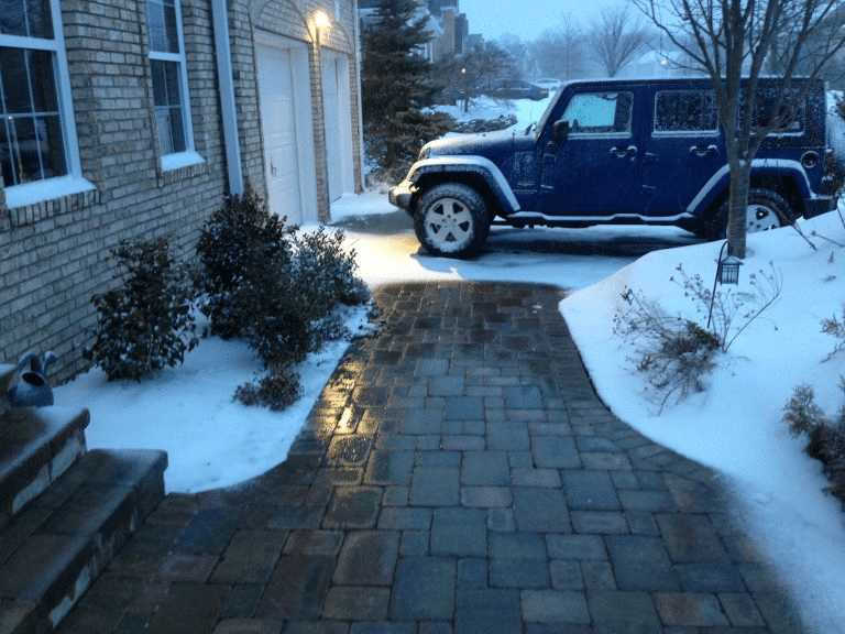 clear walkway leading to a driveway because of radiant floor heating