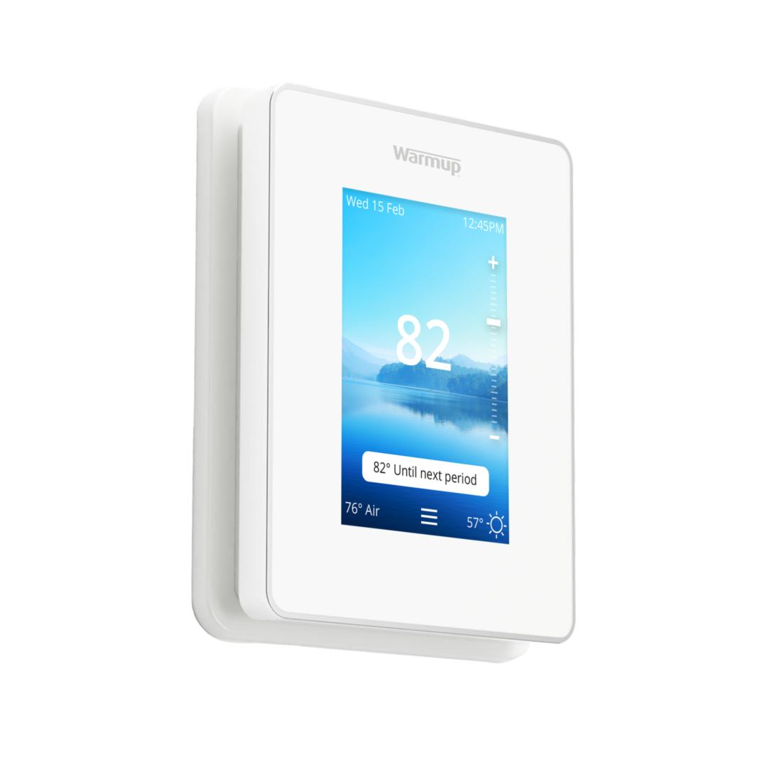 A Warmup 6iE Smart Thermostat displaying 82 degrees Fahrenheit.