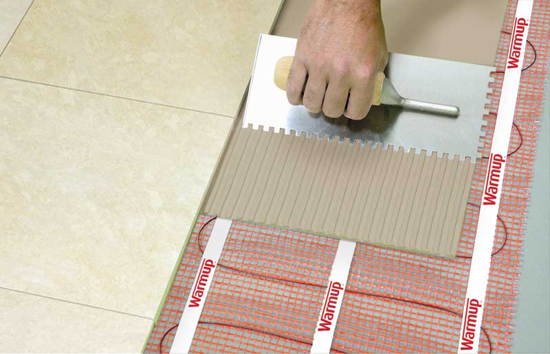 Installation of Warmup's StickyMat electric radiant floor heat under tile floors.
